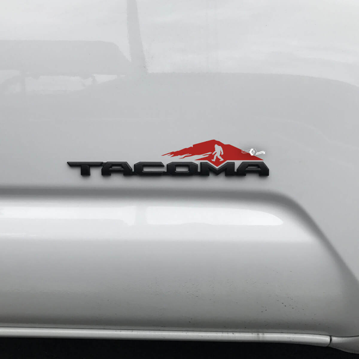 Toyota Tacoma Mountains Bigfoot Sasquatch Yeti Decal Sticker Over Badge Tacoma